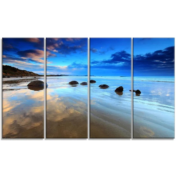 Design Art 'Cloudy Sky Over Moeraki Boulders' Photographic Print on Wrapped Canvas, Size: 16 inch H x 32 inch W x 1 inch D, Blue