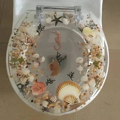 Daniels Bath Sea Treasure Decorative Round Toilet Seat Color: Clear
